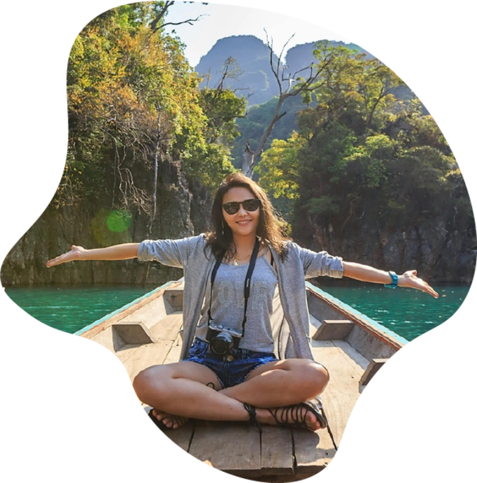 Happy tourist exploring lush adventure destination by boat